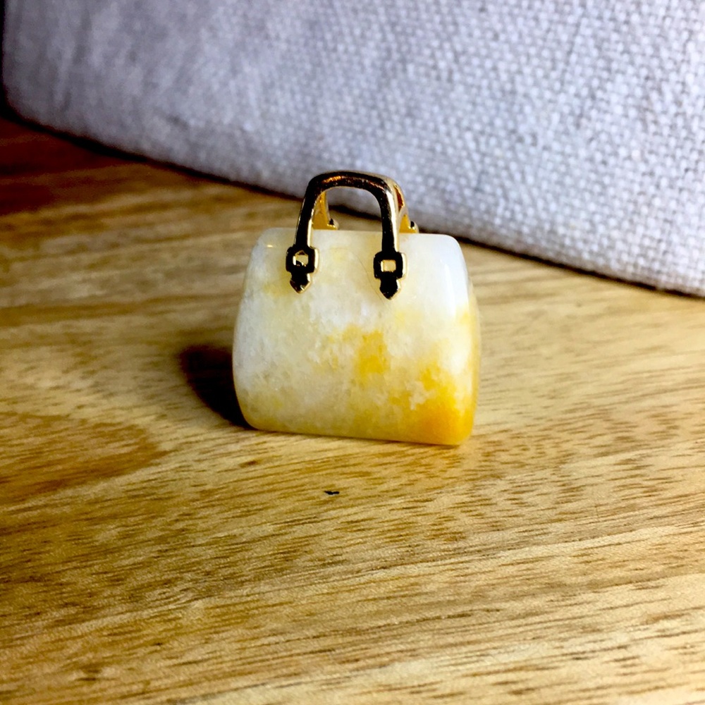 Stone purse, excellent condition.  Perfect on gold chain, nice statement piece.